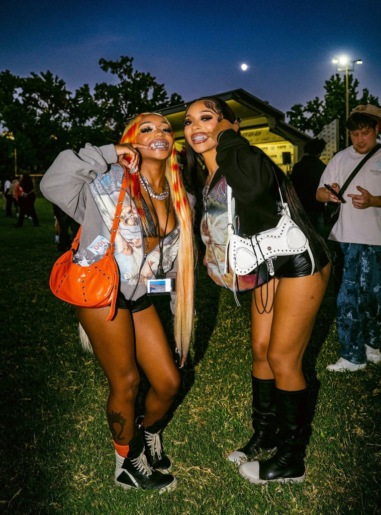 Two attendees smiling together at Invisible Land Festival